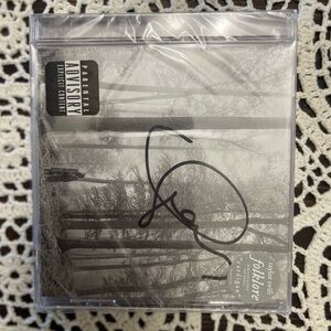 Signed Taylor Swift CDs. Folklore, Evermore, Fearless.